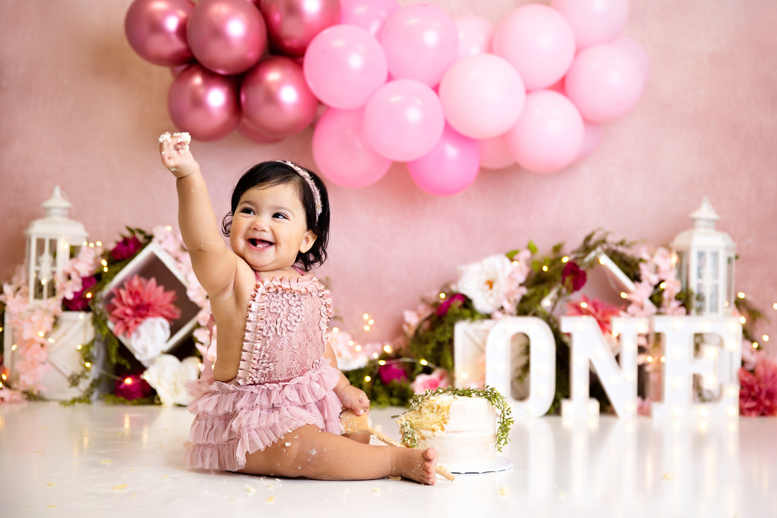 Baby smashing a cake during a photo shoot