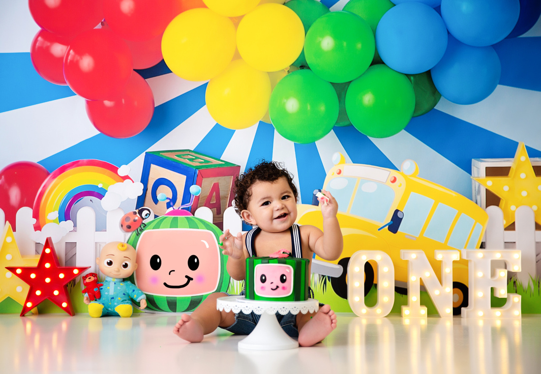 Baby smashing a cake during a photo shoot