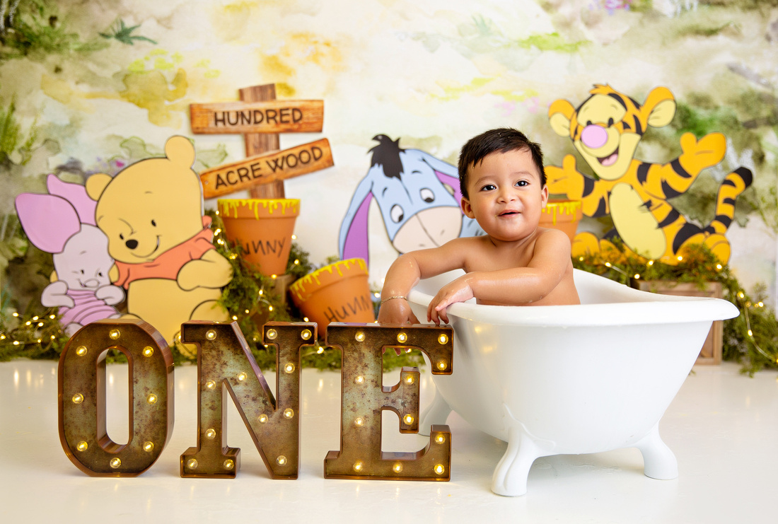 Baby smashing a cake during a photo shoot