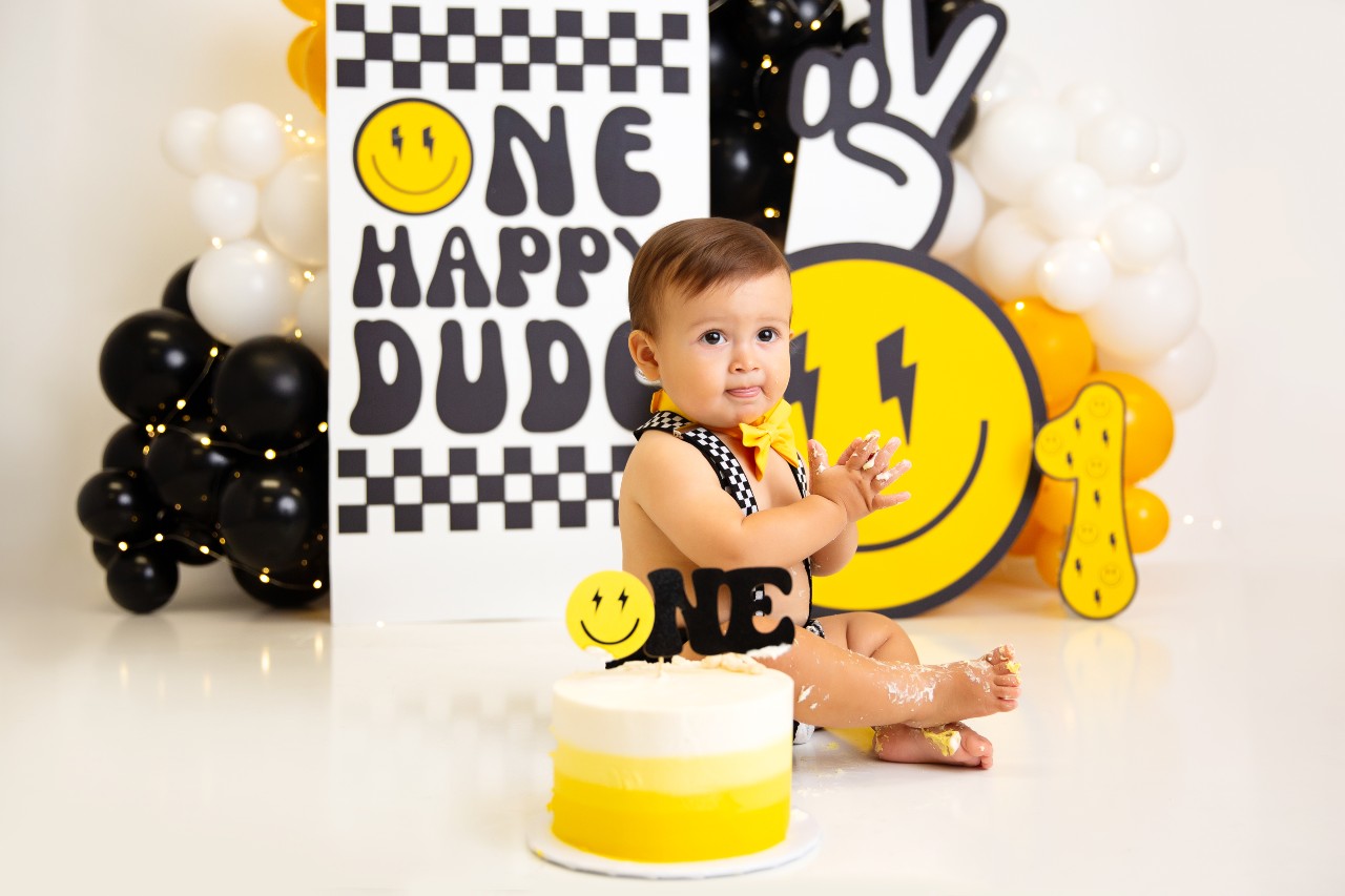 Baby smashing a cake during a photo shoot