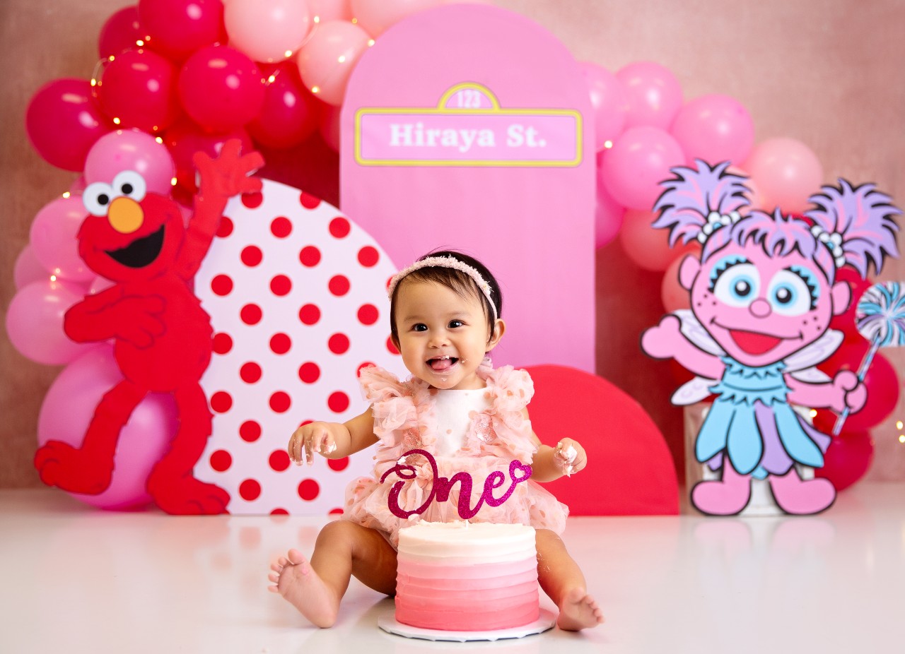Baby smashing a cake during a photo shoot