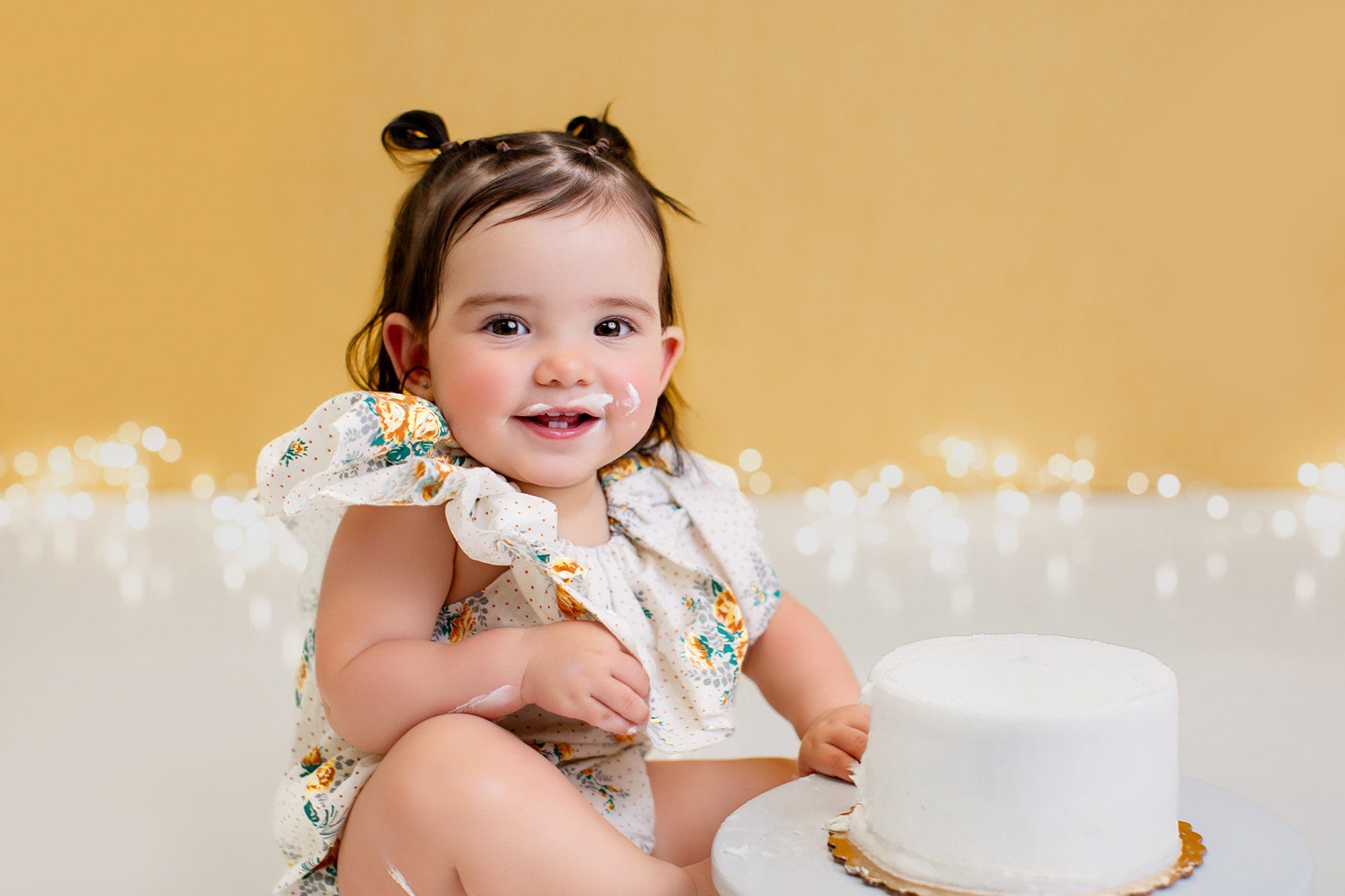 Baby smashing a cake during a photo shoot