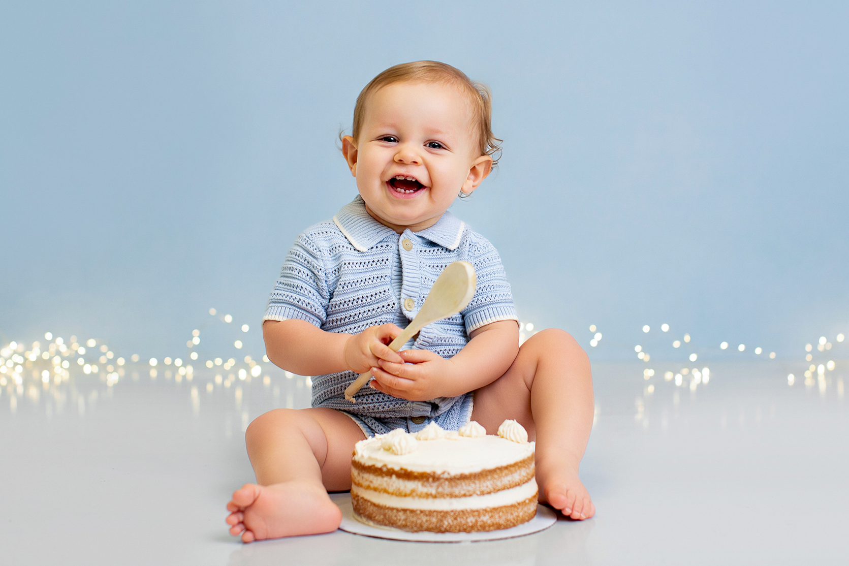 Baby smashing a cake during a photo shoot