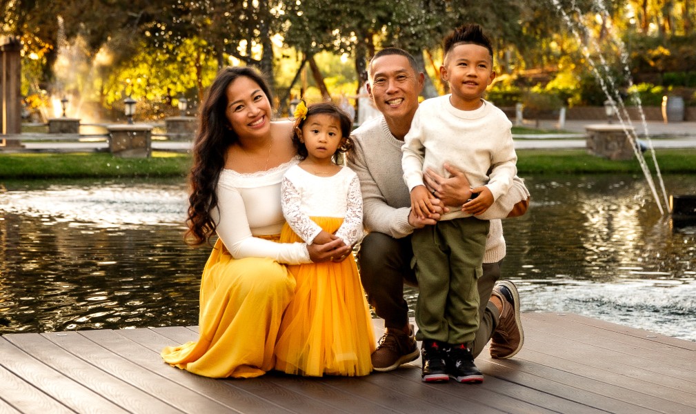 Temecula family photography standing on a dock over a lake